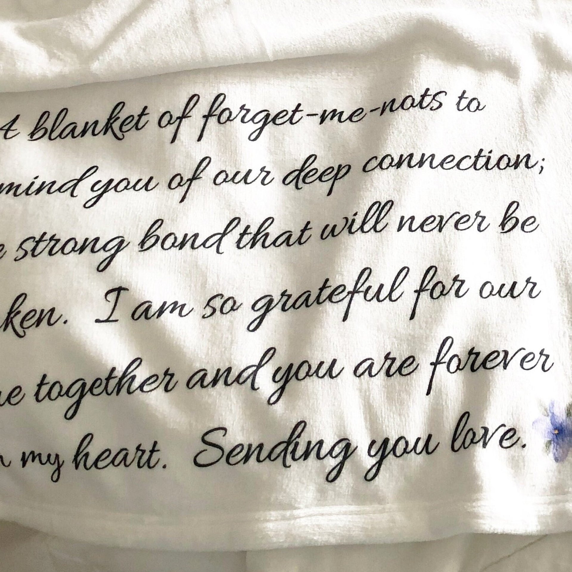 A Memorial Throw Blanket of forget-me-nots for someone who lost someone, a blanket of forget-me-nots
